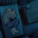Chainsaw Man's Denji and Pochita, curled up on a futon.